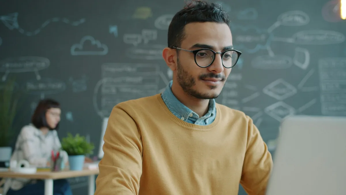 Cloud SaaS workspace with a specialist working on business applications